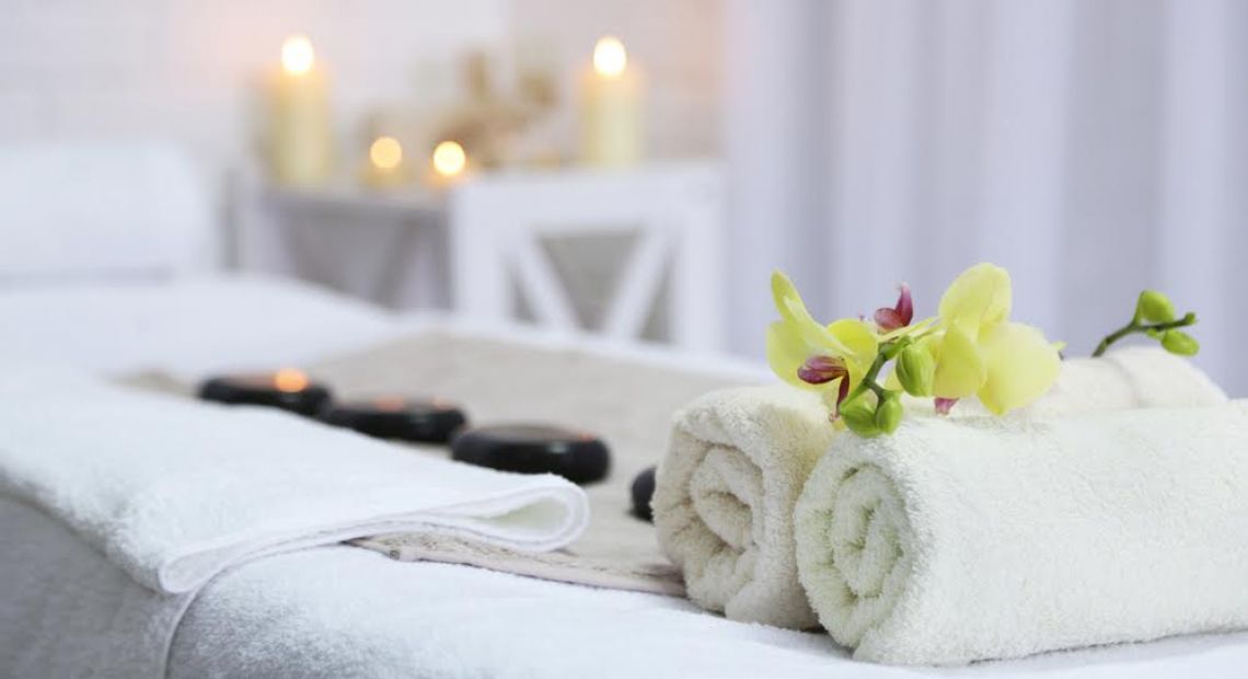 towels, flowers, stones and candles for SPA treatment