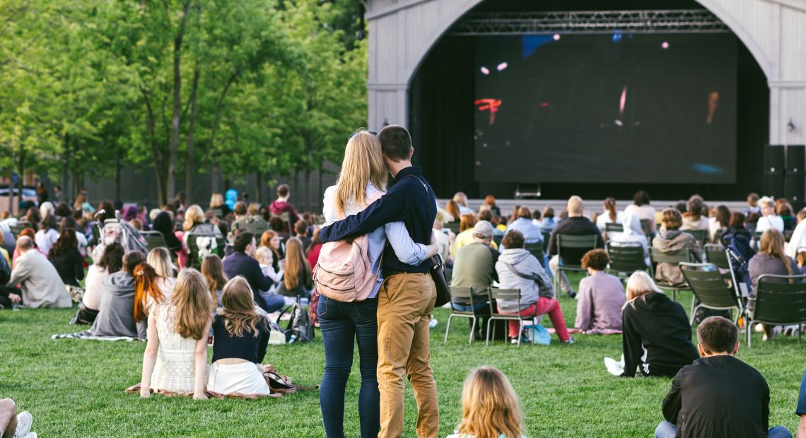 Couple hugging on an outdoor movie showing