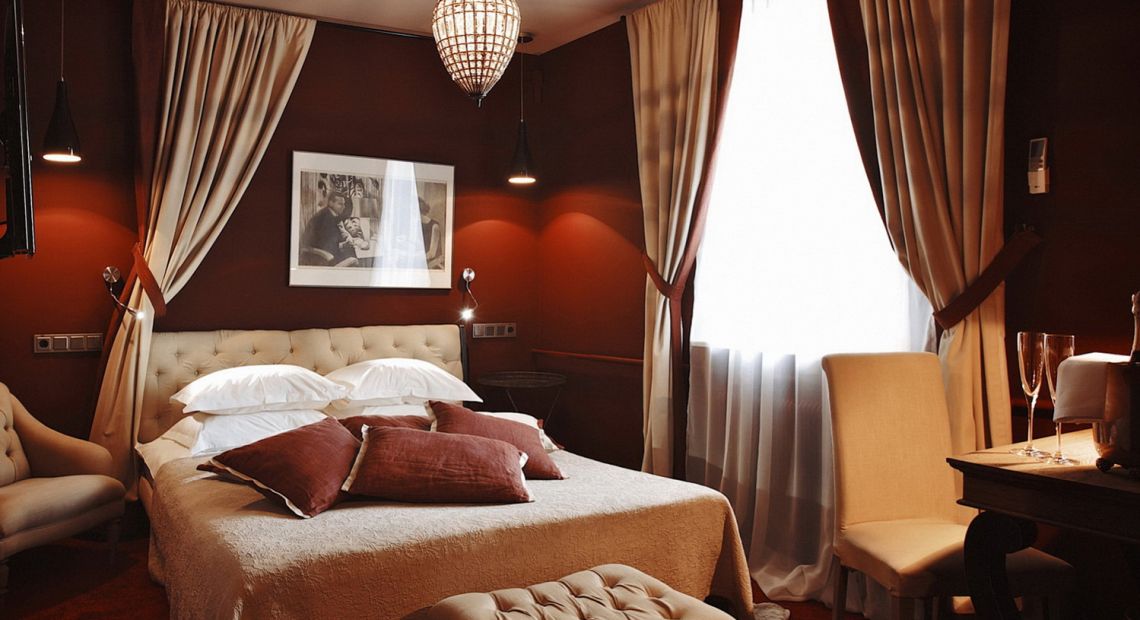 hotel room interior in red and beige colors