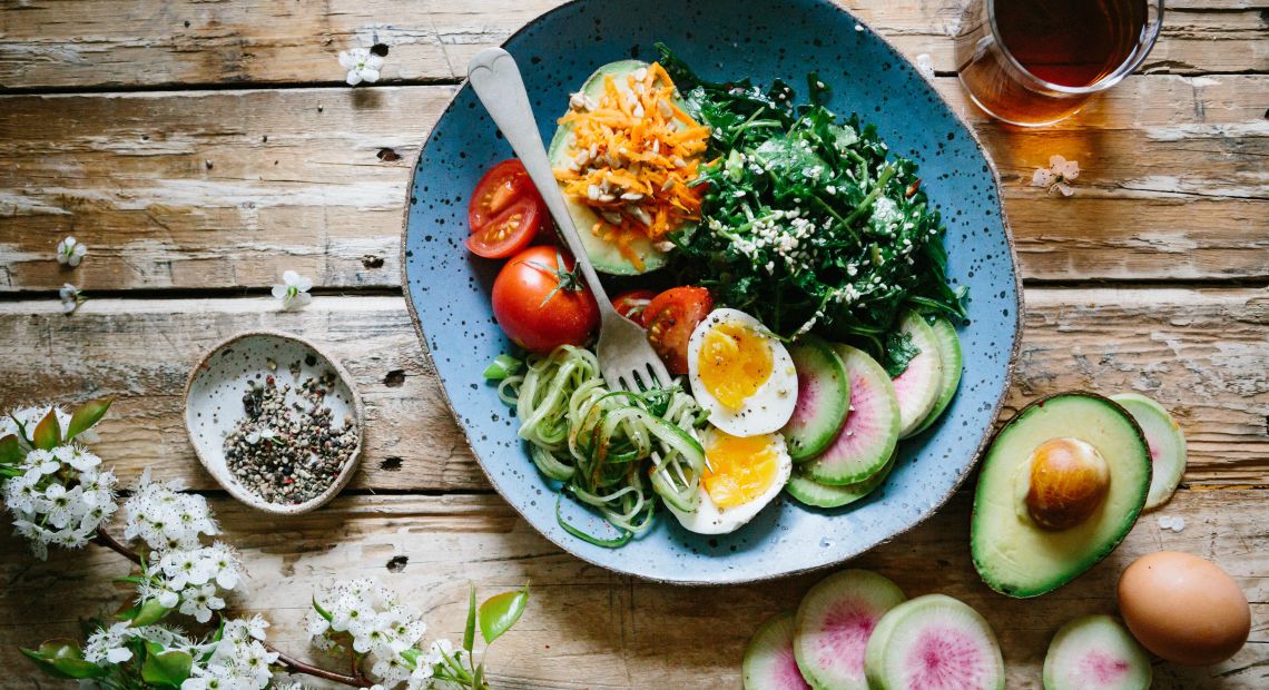 Table set with avocado and eggs