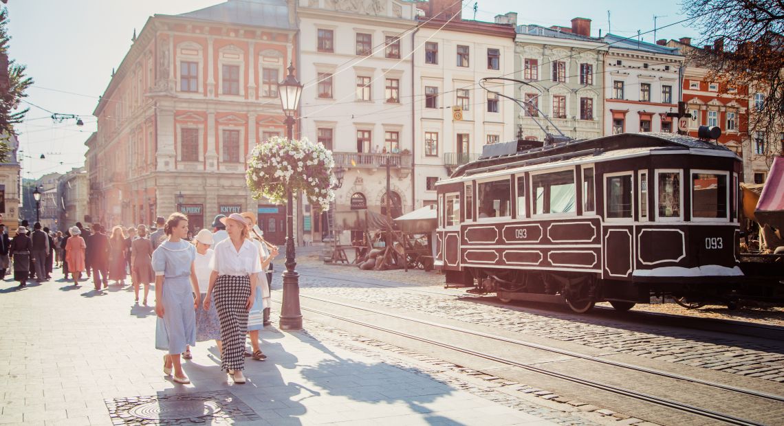 Women in vintage clothes stroll the Lviv street