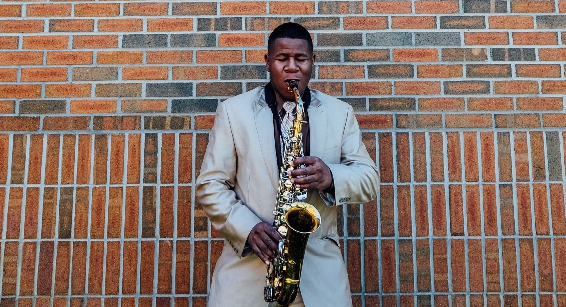 Black man playing sax