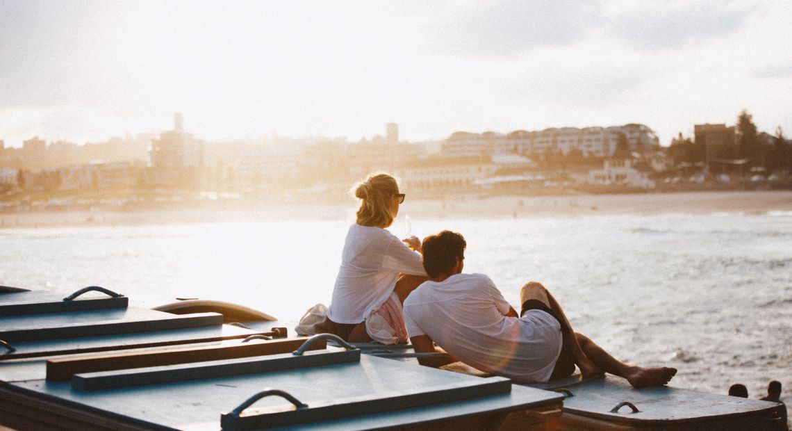 Couple resting near water