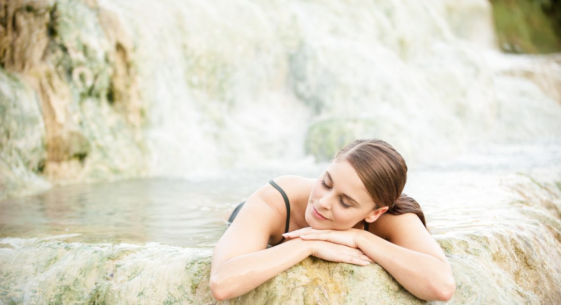 Woman relaxing in a hot spring