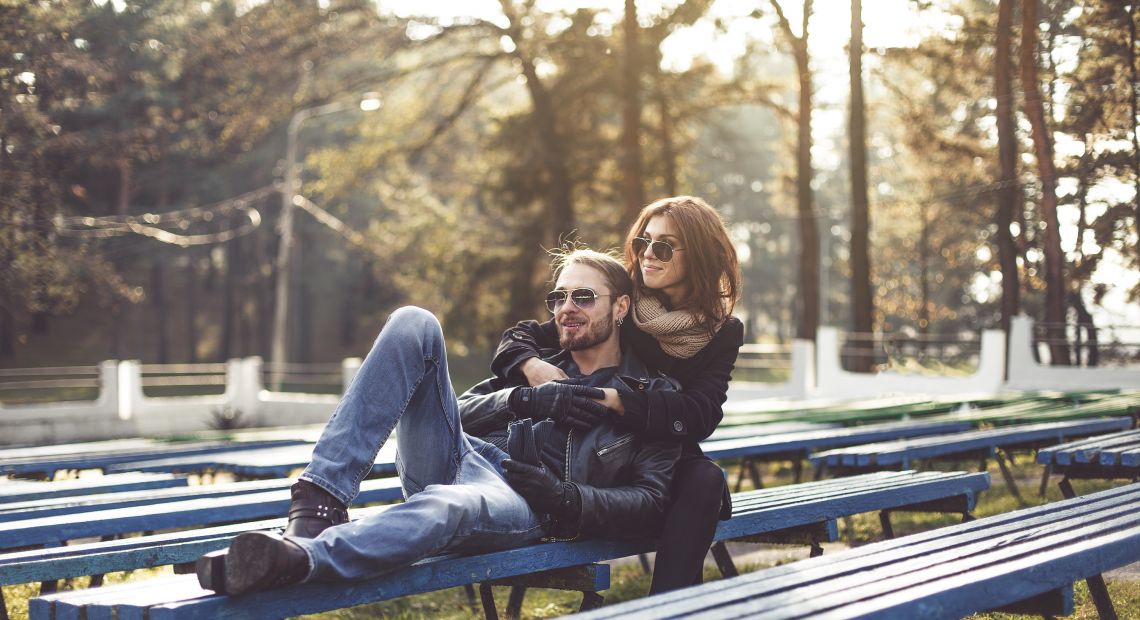 Young couple walking in an autumn park