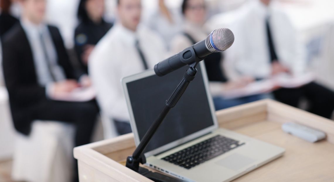 Laptop and a mic on a business conference