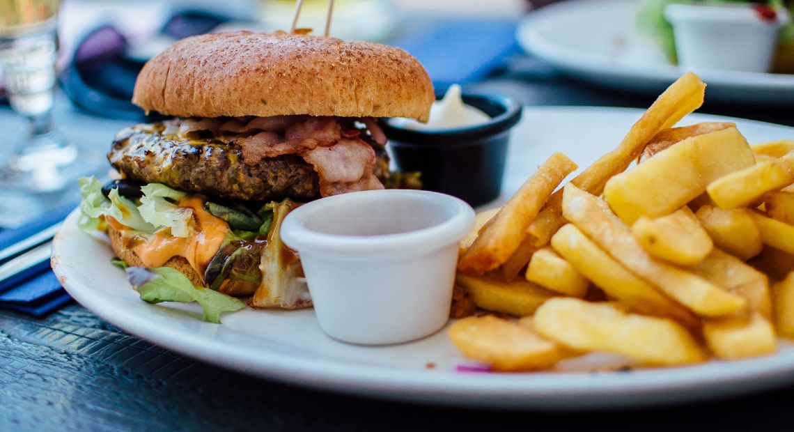 Burger and french fries on a plate