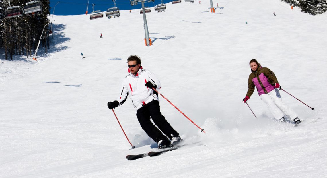 Couple skiing on the slopes
