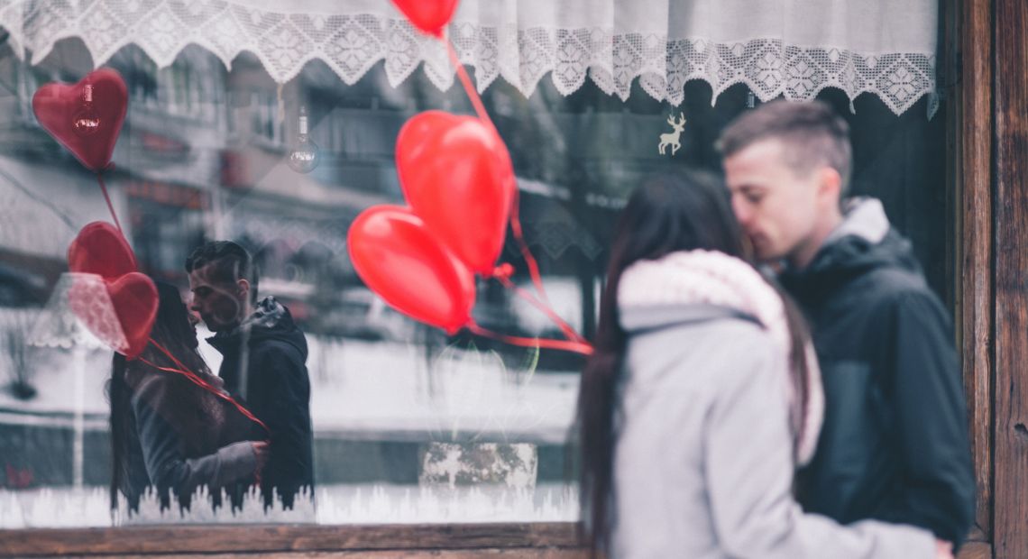 Couple with heart-shaped balloons