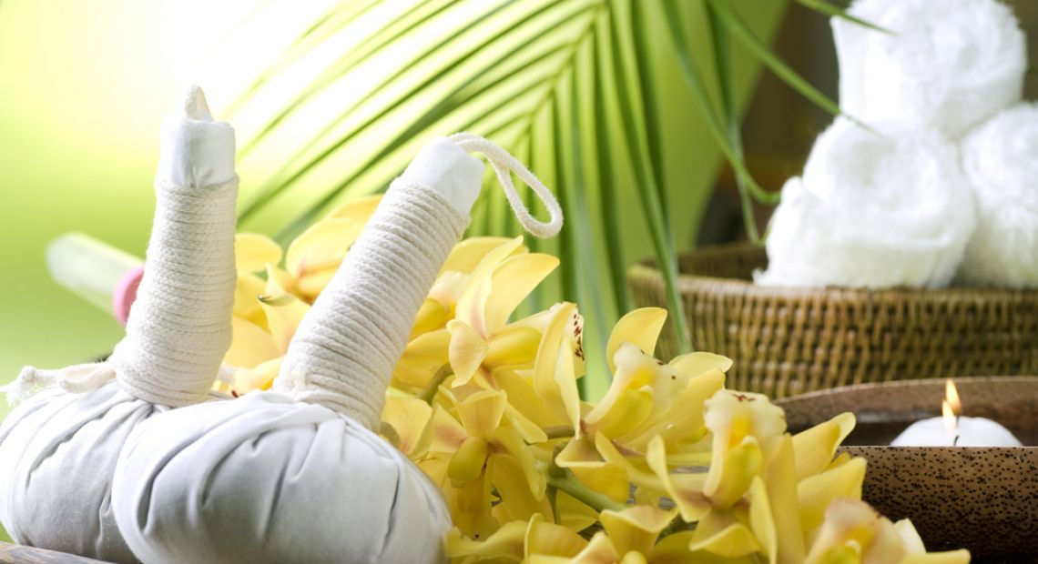 candles, towels and flowers for thai massage