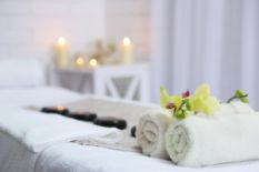 towels, flowers, stones and candles for SPA treatment