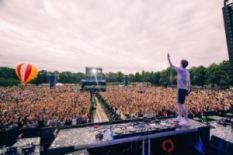 dj playing in front of crowd on festival