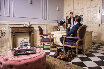 guest at reception at stylish hotel