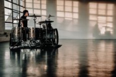 Drummer in a grey room