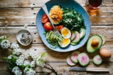 Table set with avocado and eggs