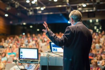 Man giving a speech on a business conference