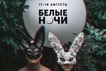 A couple wearing masks in a forest