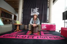 Young man sitting on an armchair in Aloft Hotel