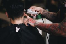 Man getting a buzz cut at a barbershop