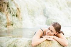 Woman relaxing in a hot spring