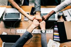 Fist bump over the table