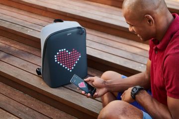 Man tuning an animated PIX backpack