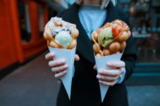 Woman holding waffles with ice cream