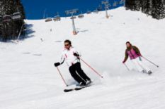 Couple skiing on the slopes