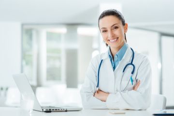 female doctor with laptop