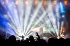 people on concert near illuminated stage
