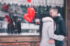 Couple with heart-shaped balloons