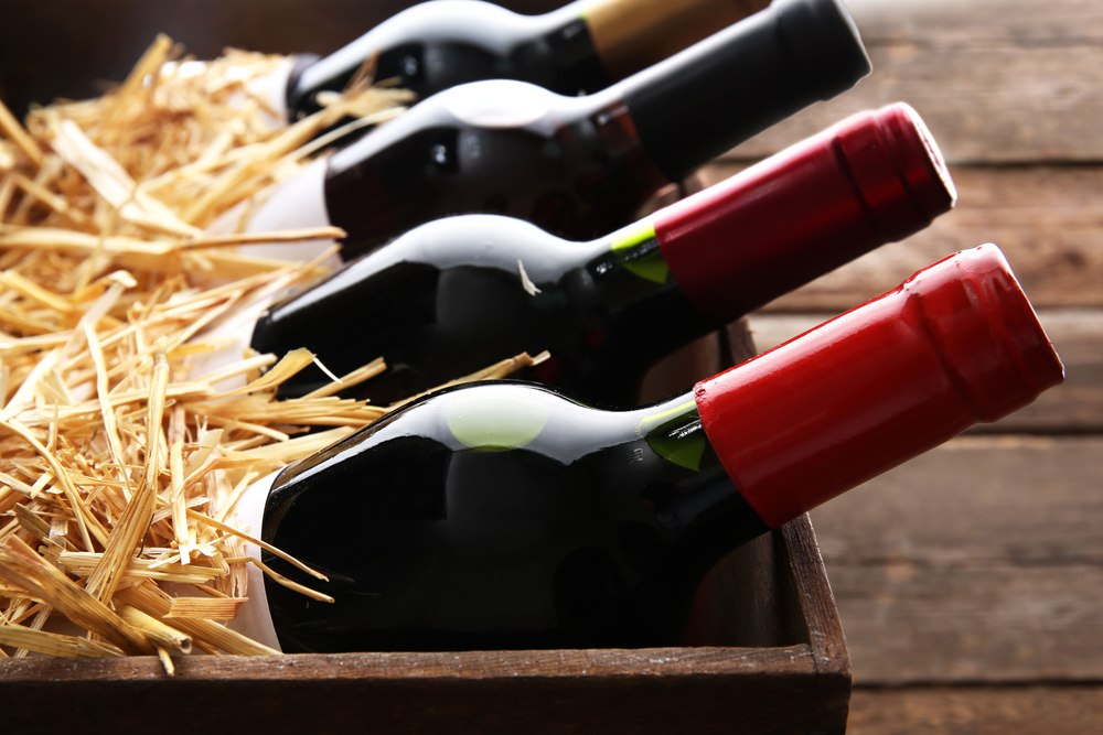 bottles with wine in straw