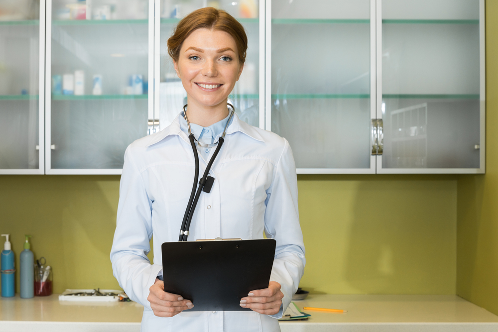 young female doctor with laptop