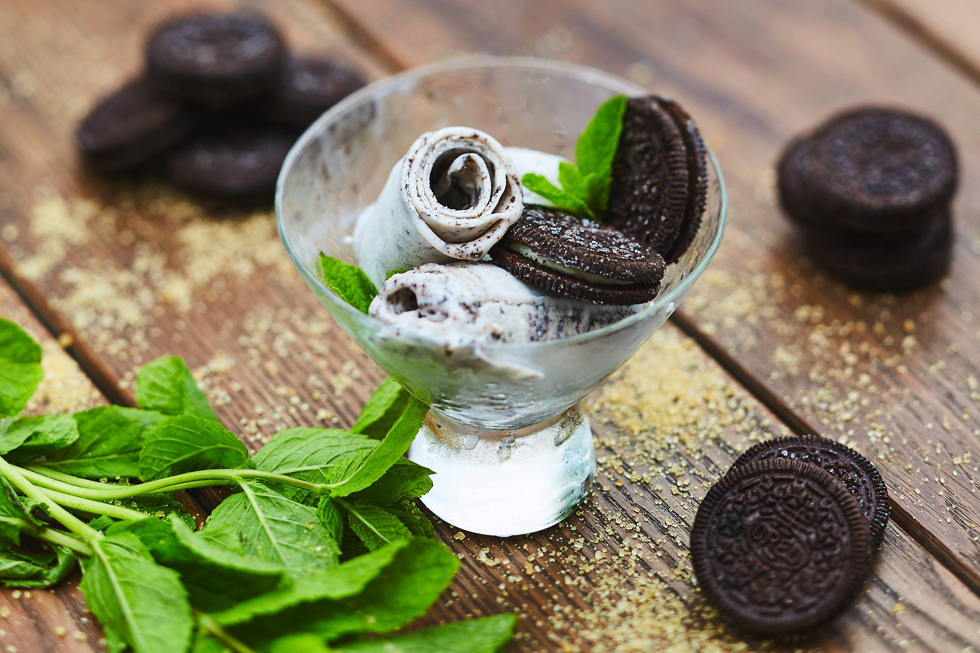 glass with sweet rolls, of ice cream, cookies and mint in glass