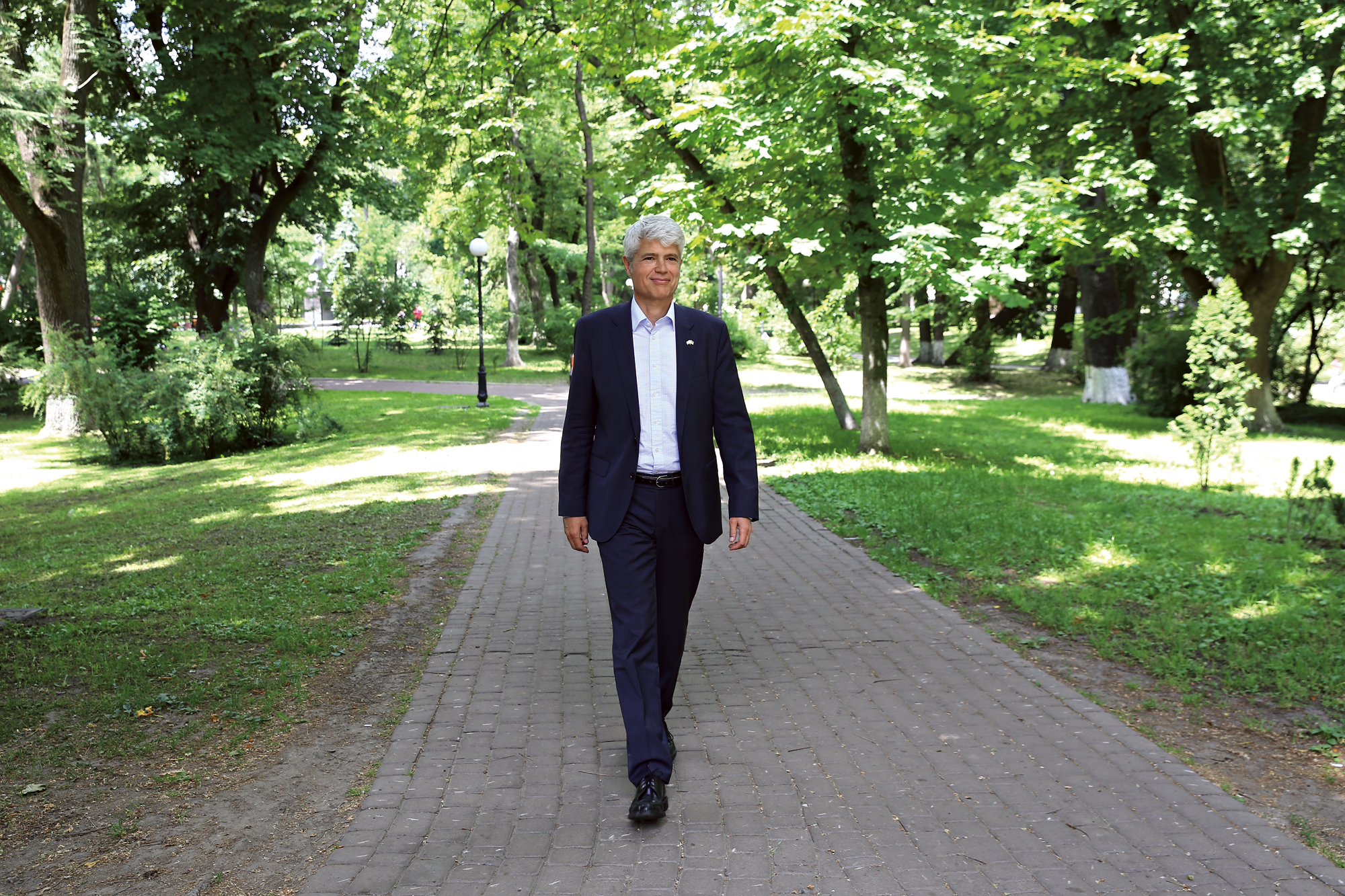 Guillaume Scheurer walking in a park