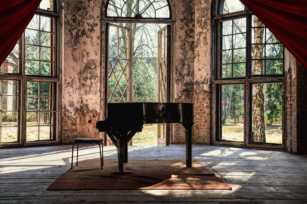 old piano in abandoned building