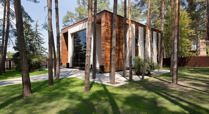 wooden building surrounded by pines