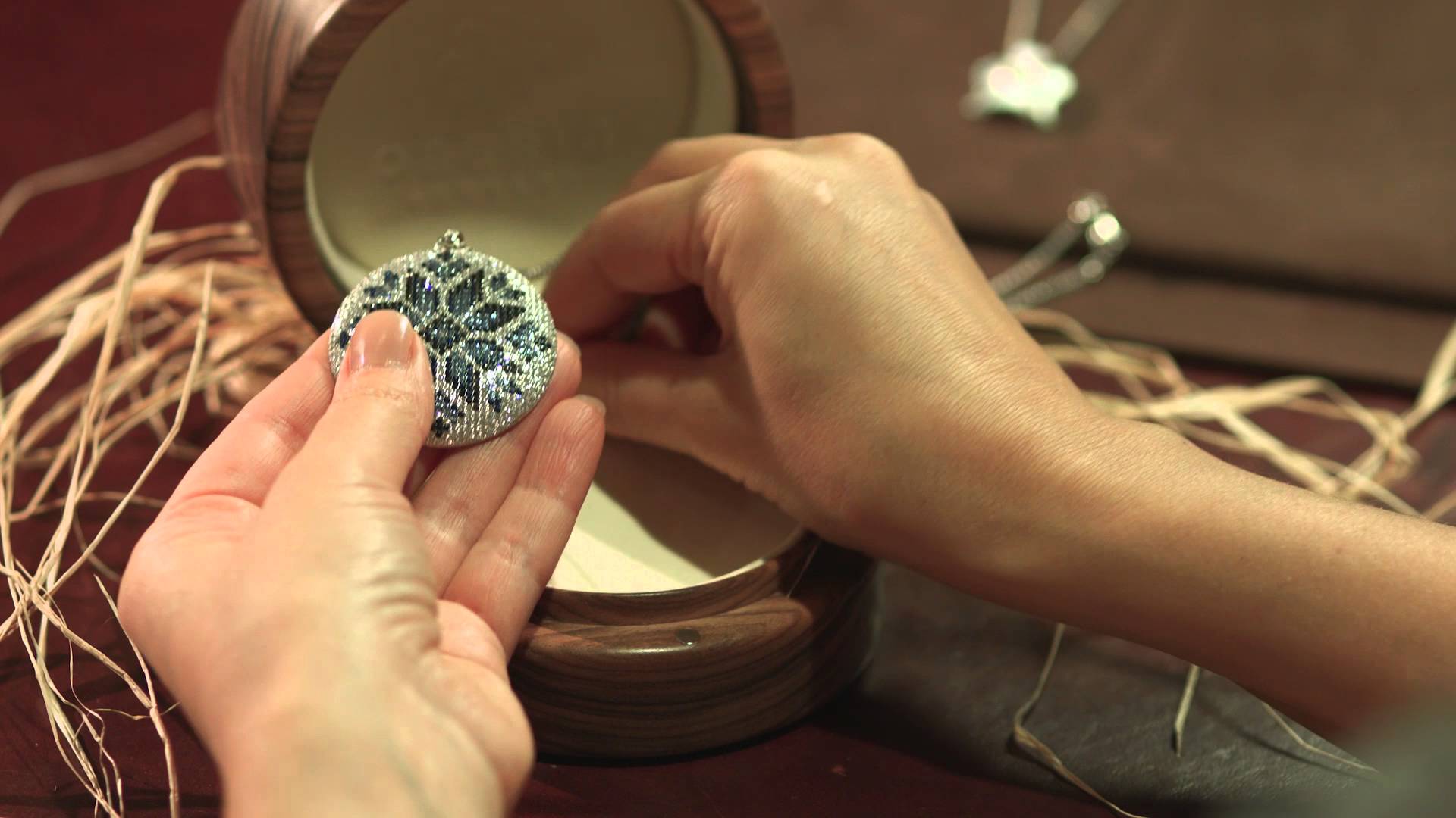 Woman holding shiny jewelry 