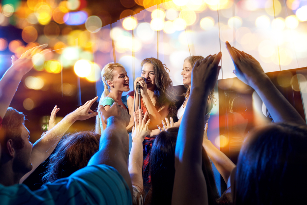 girls singing in karaoke