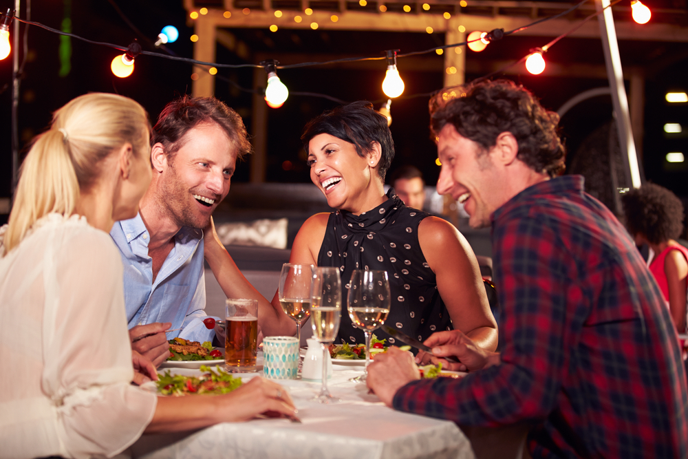 company of friends in restaurant