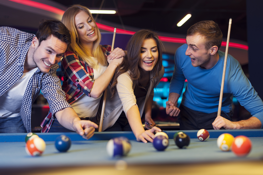 Company enjoying billiards