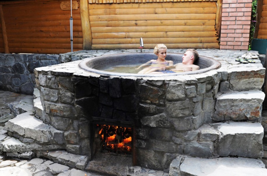 couple bathing in heated tank