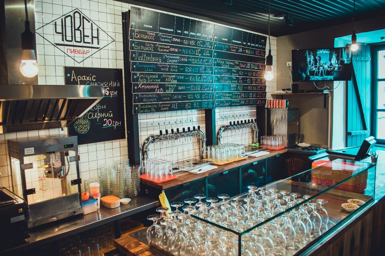 glasses, coffee machine and menu on the wall