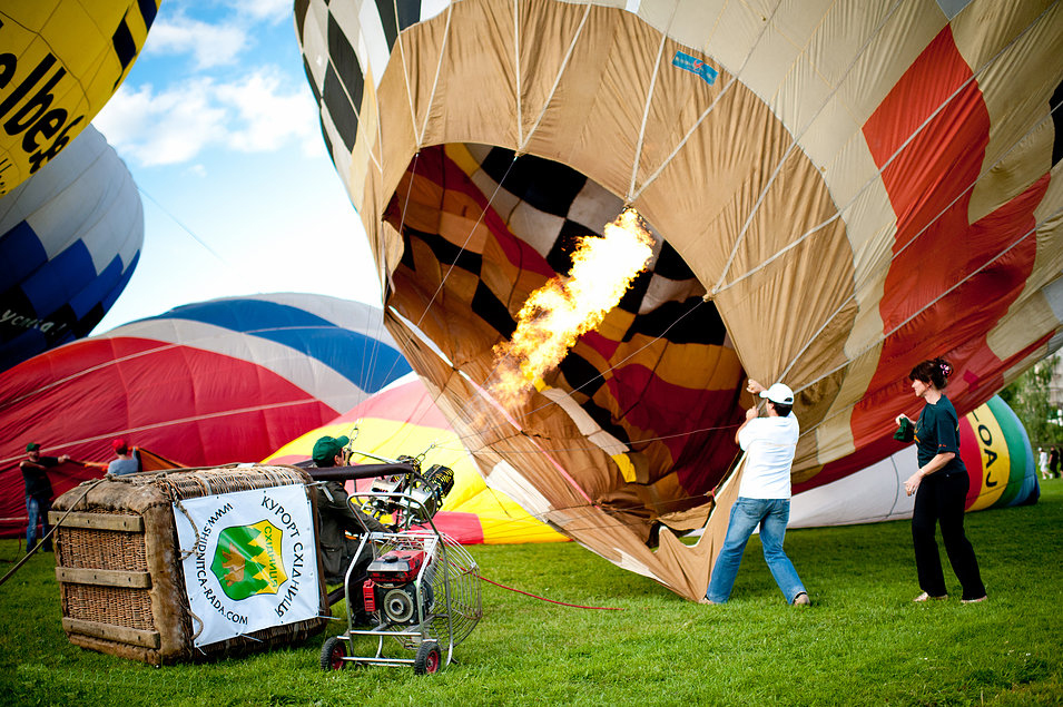 Man lighting a balloon