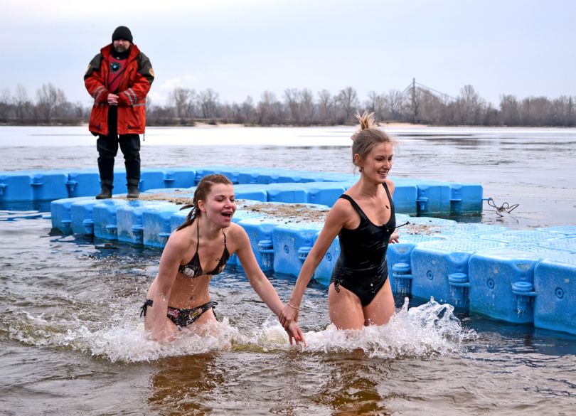 Girls plunging on Epiphany Day in Ukraine