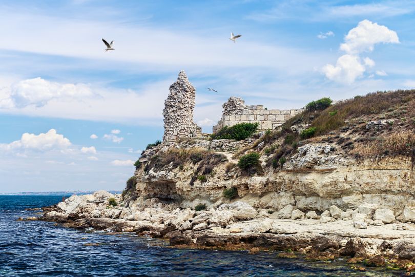 ancient ruins on rock by the sea