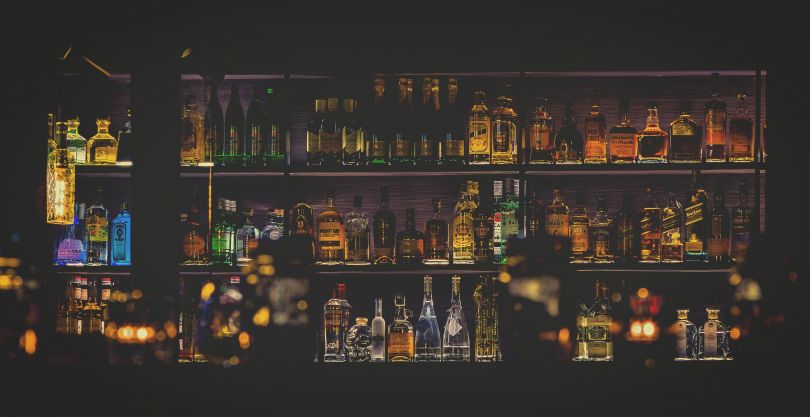 bar counter with many bottles