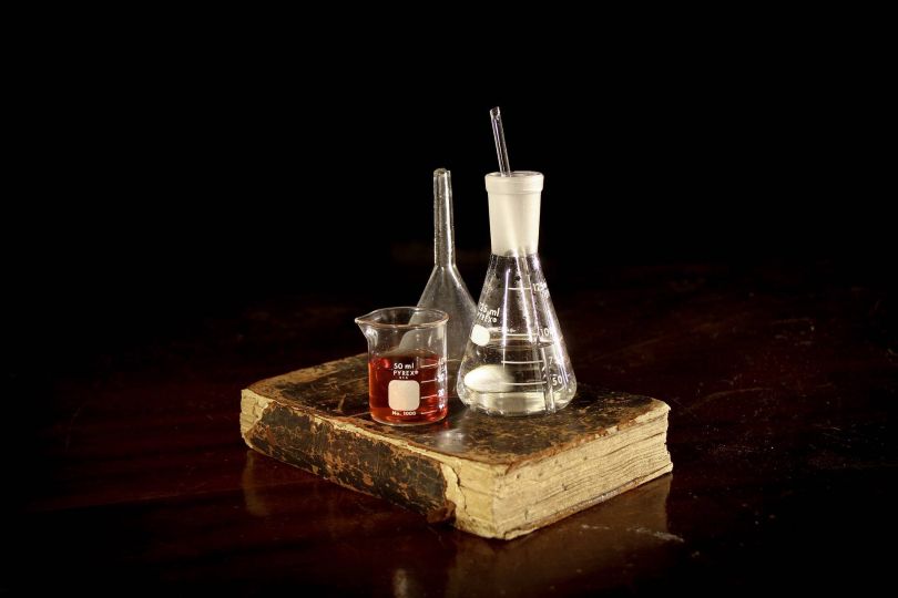 test bottles and tubes and old book