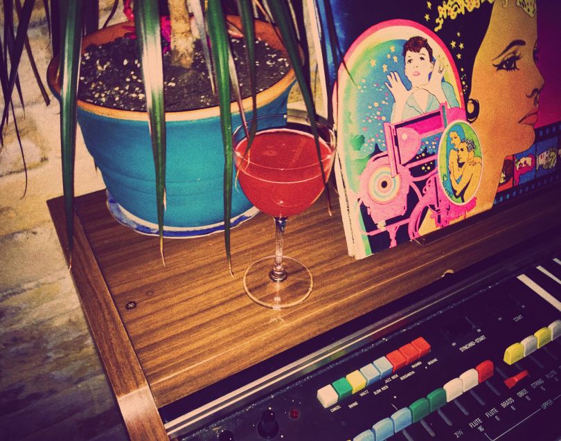 cocktail on piano with decor elements