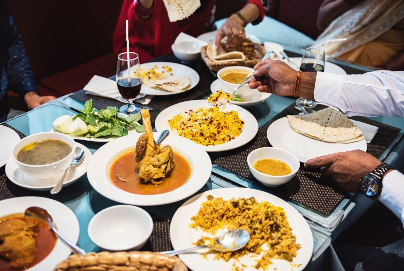 People eating Indian food